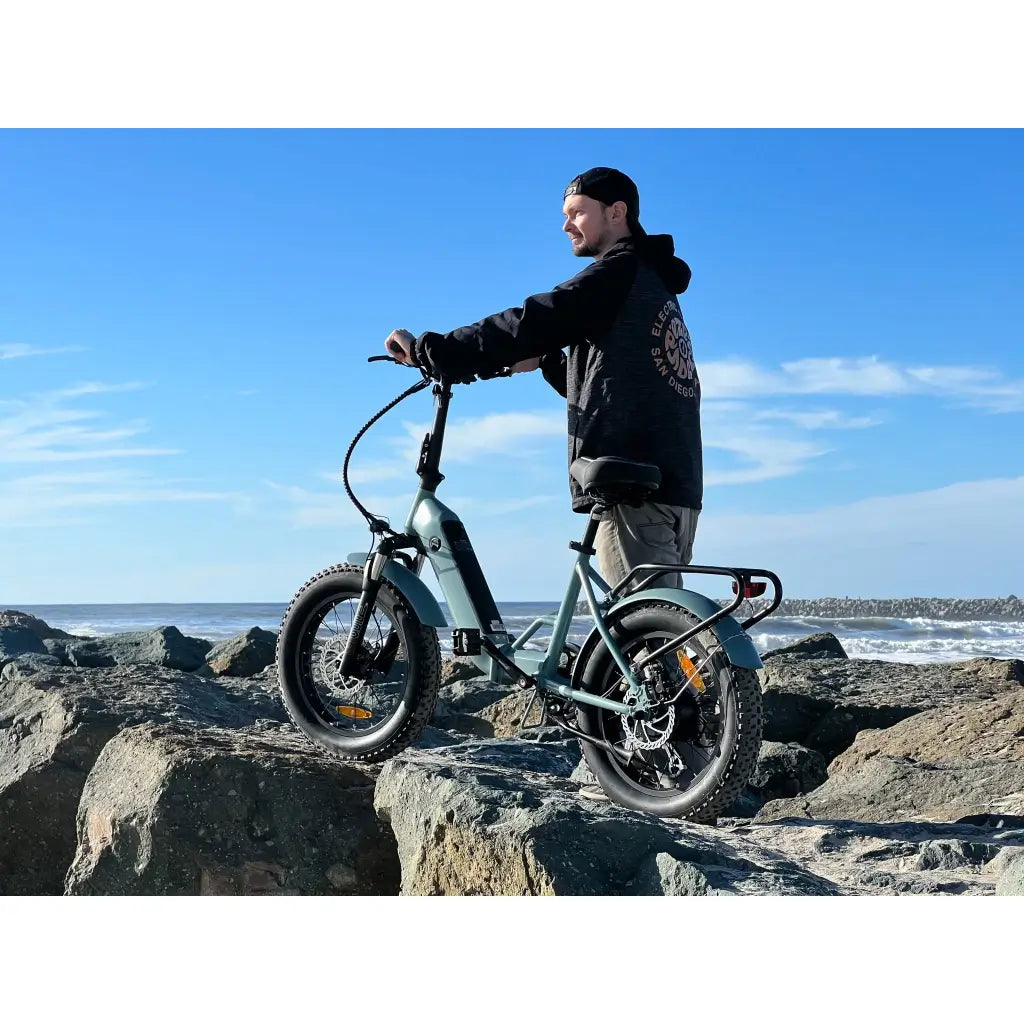 Coastal Cruiser 750W 48V Folding Fat Tire Step-Thru Electric Bike gray on rocks